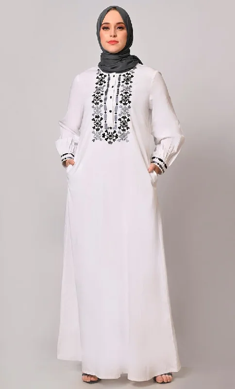 Embroidered Opulence: White Abaya with Practical Pockets