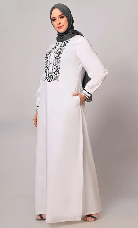 Embroidered Opulence: White Abaya with Practical Pockets