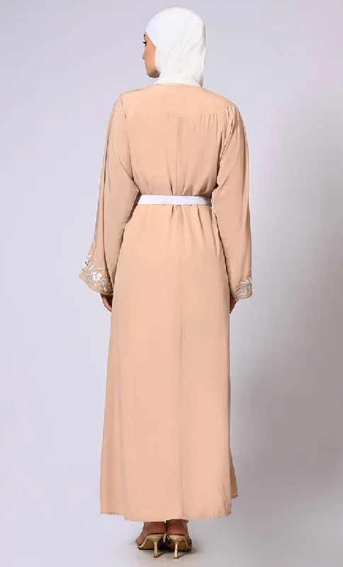 Embroidered Enchantment: Graceful Sand Abaya with Delicate Details and Belt